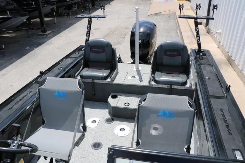 Slide: The Image of 2022 Tracker Targa V-19 Combo boat interior with seating and fishing rod holders. - 22