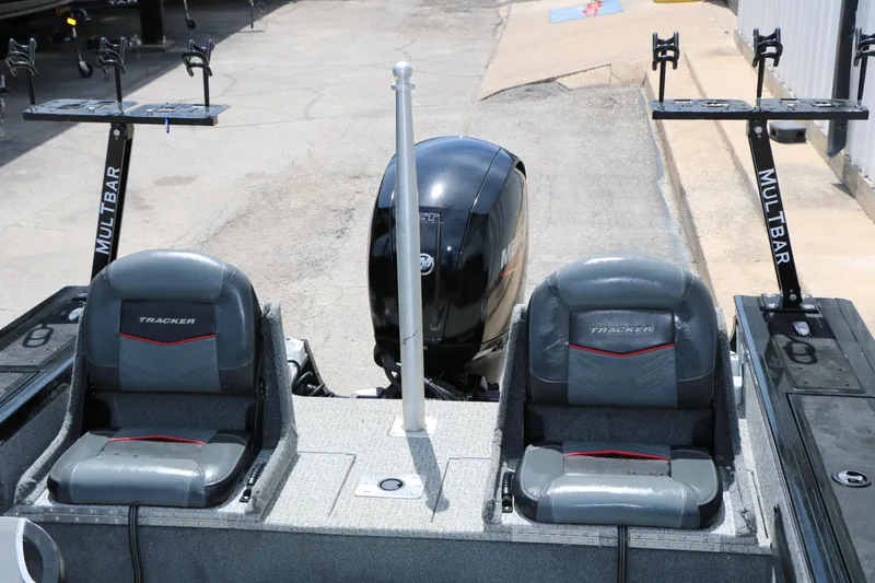 Slide: The Image of 2022 Tracker Targa V-19 Combo boat interior with dual seats and Mercury engine. - 23