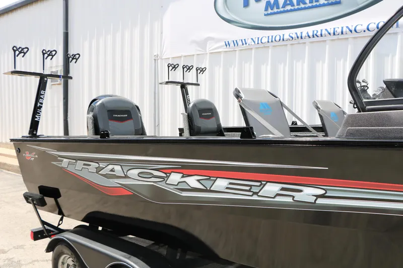 Slide: The Image of 2022 Tracker Targa V-19 Combo boat with dual engines and fishing rod holders. - 24