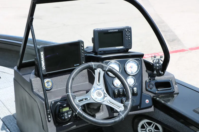 Slide: The Image of 2022 Tracker Targa V-19 Combo dashboard with Lowrance electronics and steering wheel. - 26