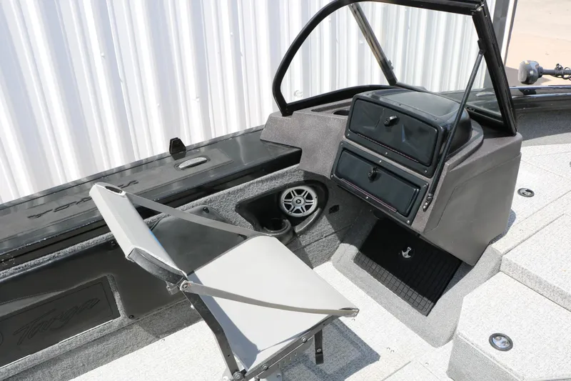 Slide: The Image of 2022 Tracker Targa V-19 Combo boat interior with seating and storage compartments. - 28