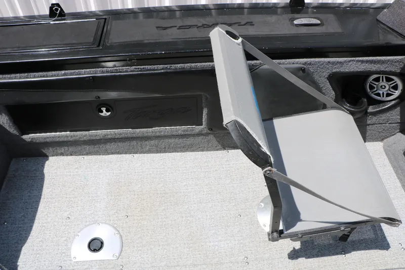 Slide: The Image of 2022 Tracker Targa V-19 Combo boat interior with gray seating and storage compartments. - 29