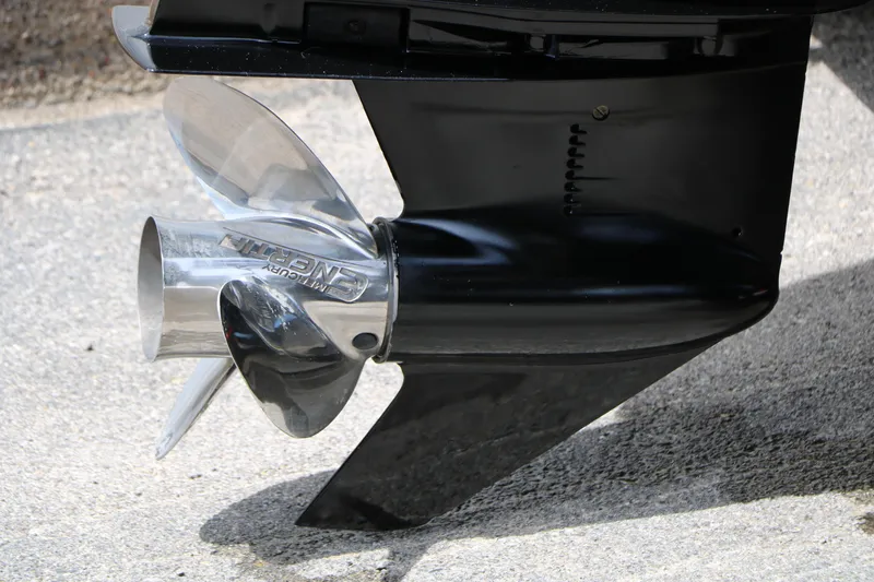 Slide: The Image of Close-up of a 2022 Tracker Targa V-19 Combo boat propeller on concrete surface. - 7