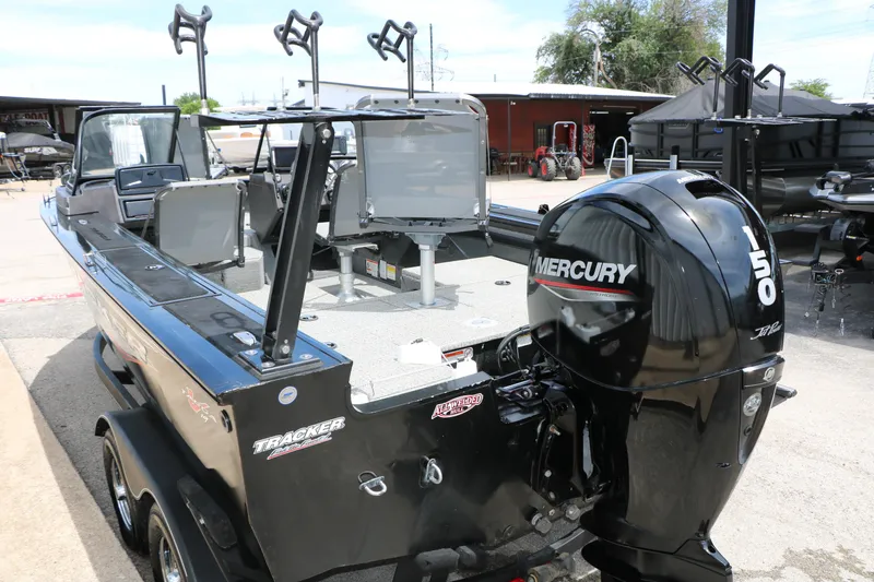 Slide: The Image of 2022 Tracker Targa V-19 Combo boat with Mercury 150 engine, parked outdoors. - 9