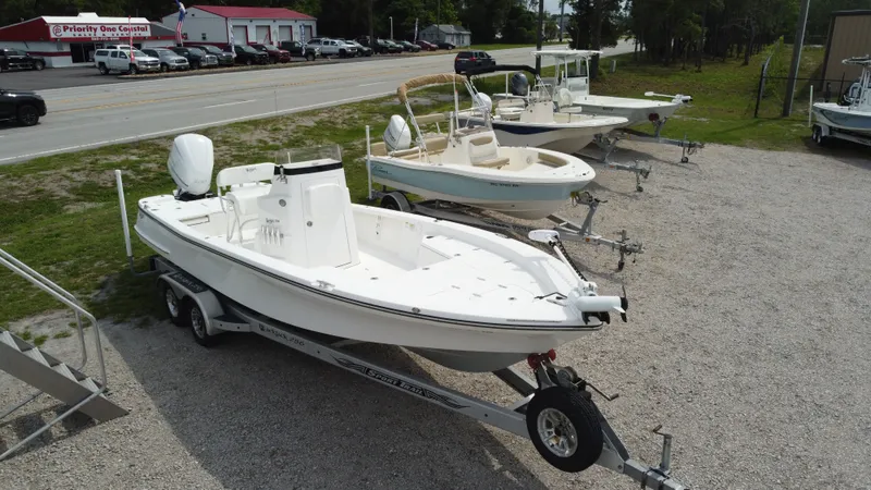 Slide: The Image of 2017 Black Jack 256 boat on trailer in outdoor showroom. - 2