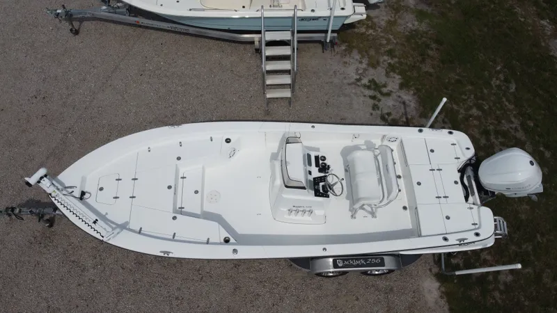 Slide: The Image of Aerial view of a 2017 Black Jack 256 boat on a trailer. - 7