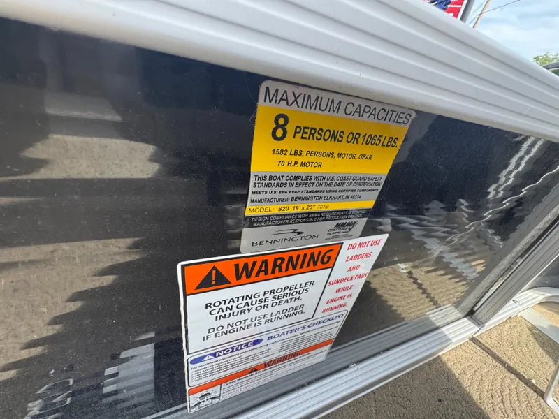Slide: The Image of Safety and capacity labels on a 2014 Bennington 20SLM boat. - 10