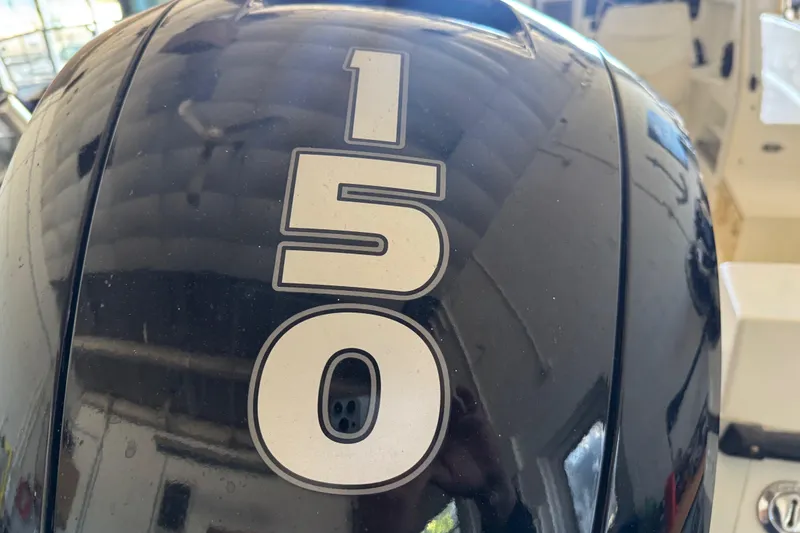 Slide: The Image of Close-up of a 150 HP outboard motor on a 1992 Bayliner 2052 Trophy Walkaround. - 10