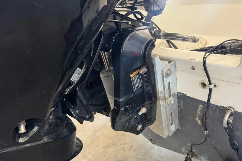 Slide: The Image of Close-up of a 1992 Bayliner 2052 Trophy Walkaround boat engine and mounting components. - 12