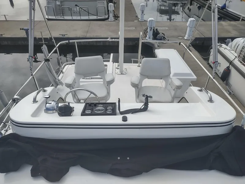 Slide: The Image of Helm of a 2005 Nordic Tug 32 docked at marina. - 10