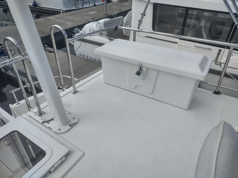 Slide: The Image of Deck of a 2005 Nordic Tug 32 with storage box. - 13