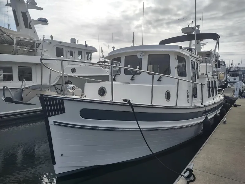 Slide: The Image of 2005 Nordic Tug 32 docked at marina. - 20