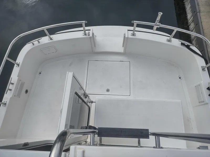 Slide: The Image of Deck of a 2005 Nordic Tug 32 boat, clean and spacious. - 22
