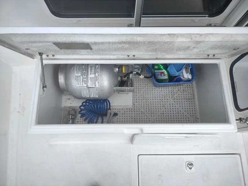 Slide: The Image of Storage compartment in 2005 Nordic Tug 32 with propane tank. - 25