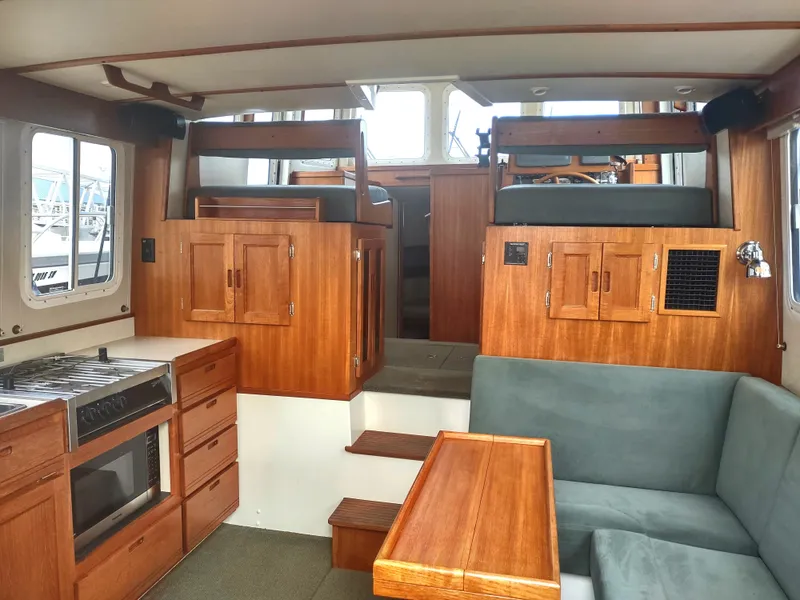 Slide: The Image of Interior of a 2005 Nordic Tug 32 with wooden furnishings. - 30