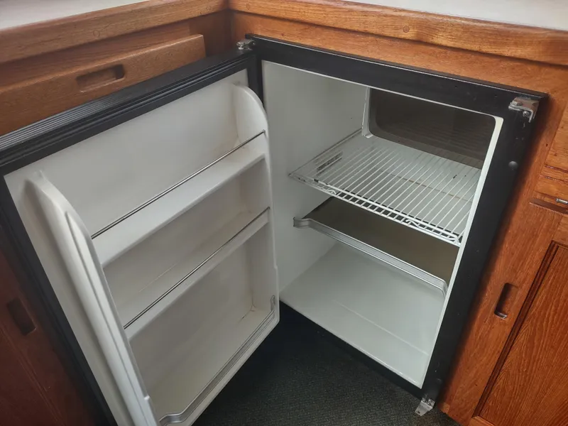 Slide: The Image of Open refrigerator in a 2005 Nordic Tug 32 boat. - 38