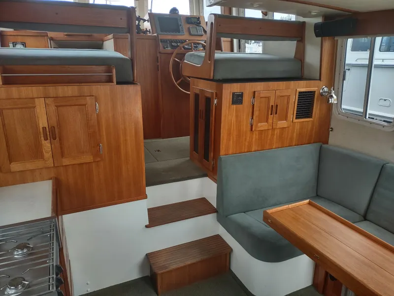 Slide: The Image of Interior of a 2005 Nordic Tug 32 with wooden furnishings. - 45