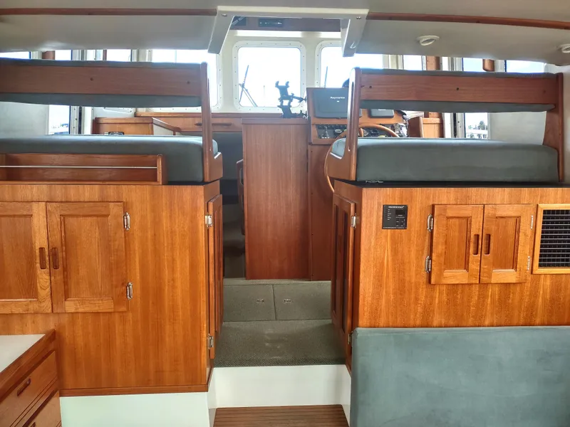 Slide: The Image of Interior of a 2005 Nordic Tug 32 with wooden cabinetry. - 46