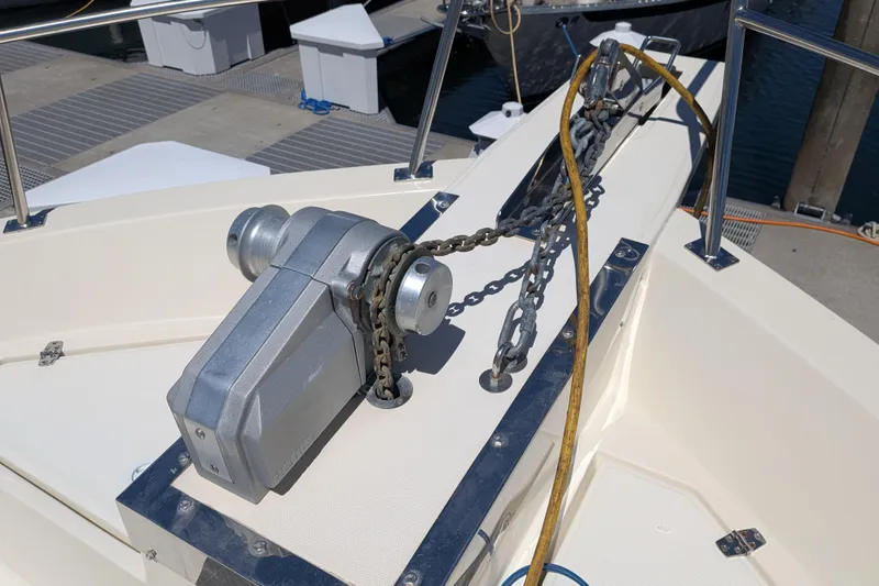 Slide: The Image of Anchor windlass on 2006 North Pacific 42 Pilothouse boat at dock. - 10