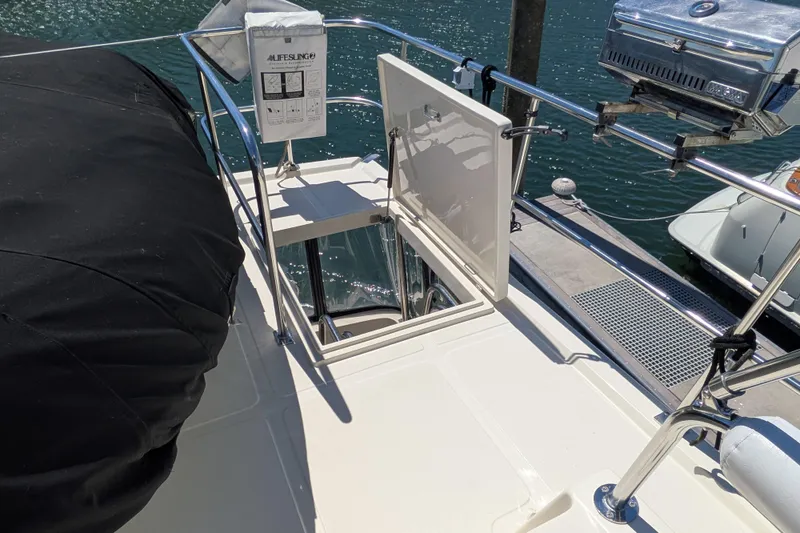 Slide: The Image of North Pacific 42 Pilothouse 2006 yacht deck with open hatch and safety equipment. - 15