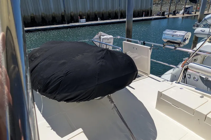 Slide: The Image of Covered equipment on 2006 North Pacific 42 Pilothouse yacht deck at marina. - 16