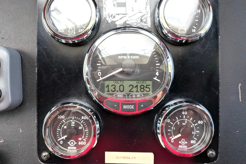 Slide: The Image of Instrument panel of a 2006 North Pacific 42 Pilothouse, displaying RPM, voltage, and engine hours. - 32