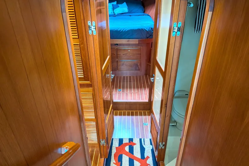Slide: The Image of Interior of 2006 North Pacific 42 Pilothouse with wooden finishes and cozy cabin. - 40