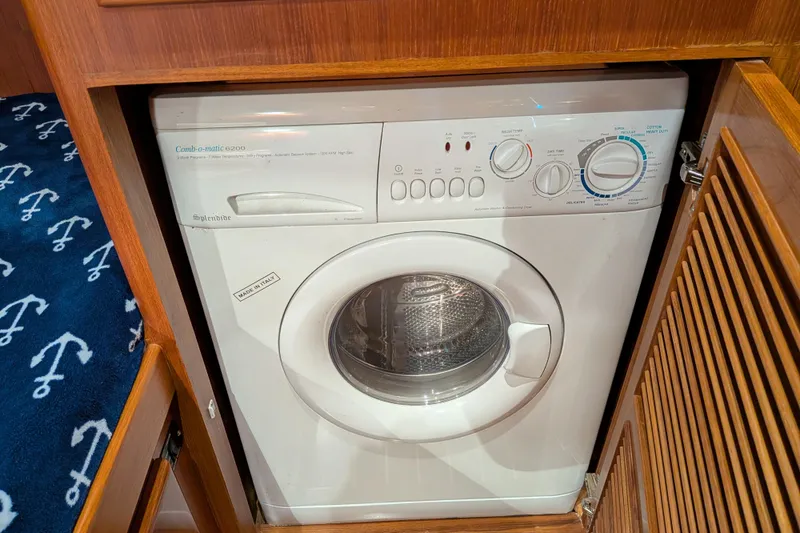 Slide: The Image of Compact washing machine in a 2006 North Pacific 42 Pilothouse yacht interior. - 48