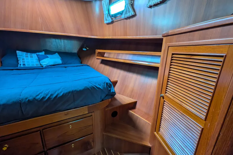 Slide: The Image of Cozy cabin interior of 2006 North Pacific 42 Pilothouse with wooden finish and bed. - 50
