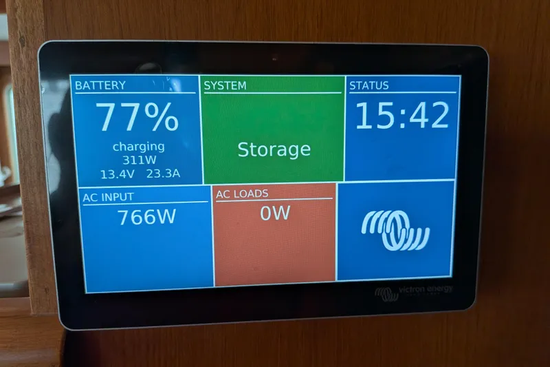 Slide: The Image of Display screen on 2006 North Pacific 42 Pilothouse showing battery and system status. - 54