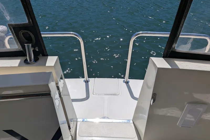 Slide: The Image of North Pacific 42 Pilothouse 2006 boat deck with ocean view. - 7