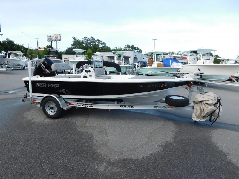 The Image of 2022 Sea Pro 172 Bay boat on trailer outdoors. - 1
