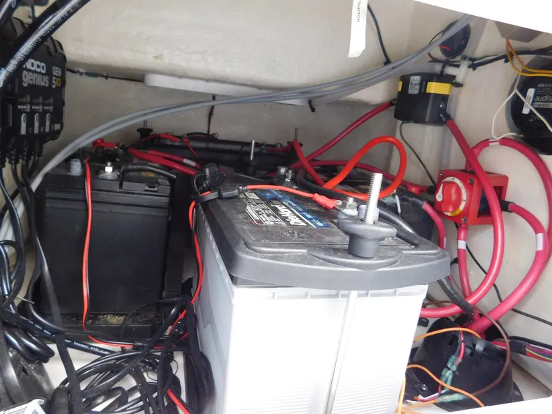 Slide: The Image of Battery compartment of a 2022 Sea Pro 172 Bay boat with wiring. - 16
