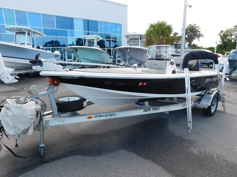 Slide: The Image of 2022 Sea Pro 172 Bay boat on trailer outside showroom. - 2