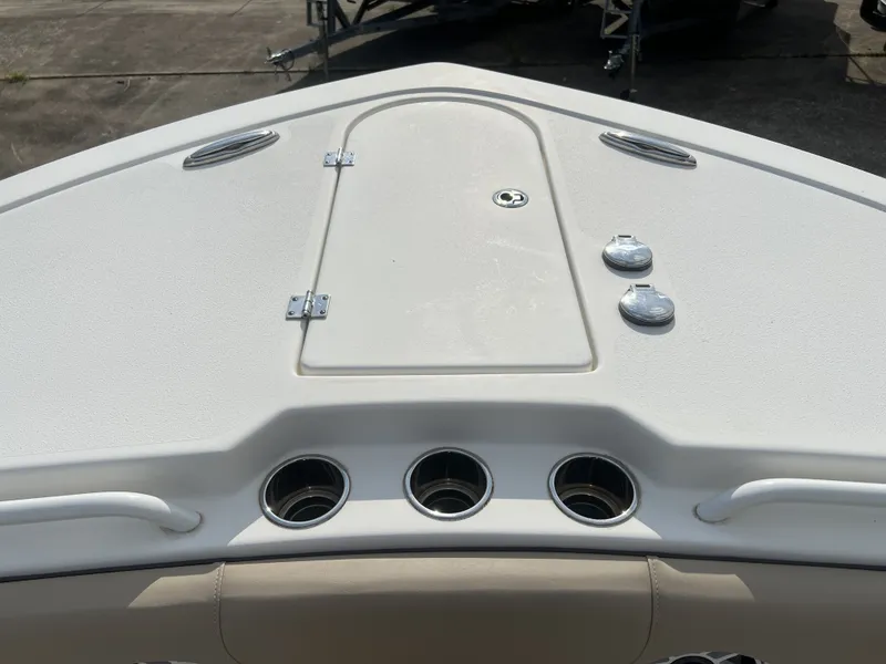 Slide: The Image of Bow deck of 2021 Tidewater 292 CC Adventure with storage and cup holders. - 20