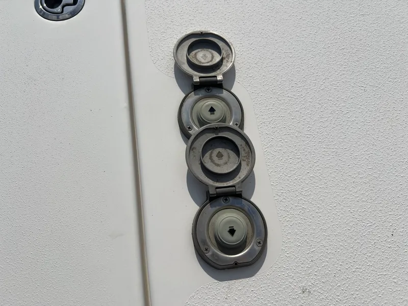Slide: The Image of Three open hatches on a 2021 Tidewater 292 CC Adventure boat. - 21