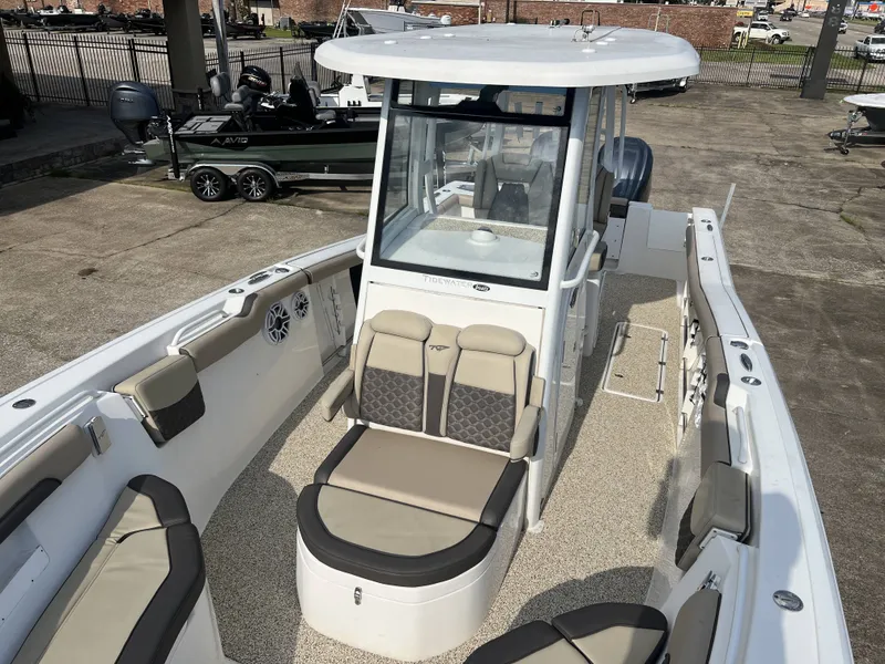Slide: The Image of 2021 Tidewater 292 CC Adventure boat with spacious deck and seating. - 23