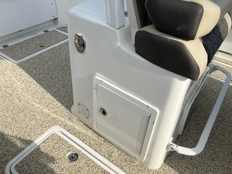 Slide: The Image of Tidewater 292 CC Adventure 2021 boat cabin with seat and storage. - 42