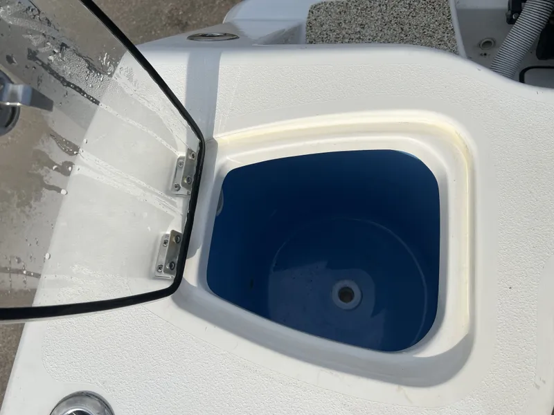 Slide: The Image of Open storage compartment on a 2021 Tidewater 292 CC Adventure boat. - 48