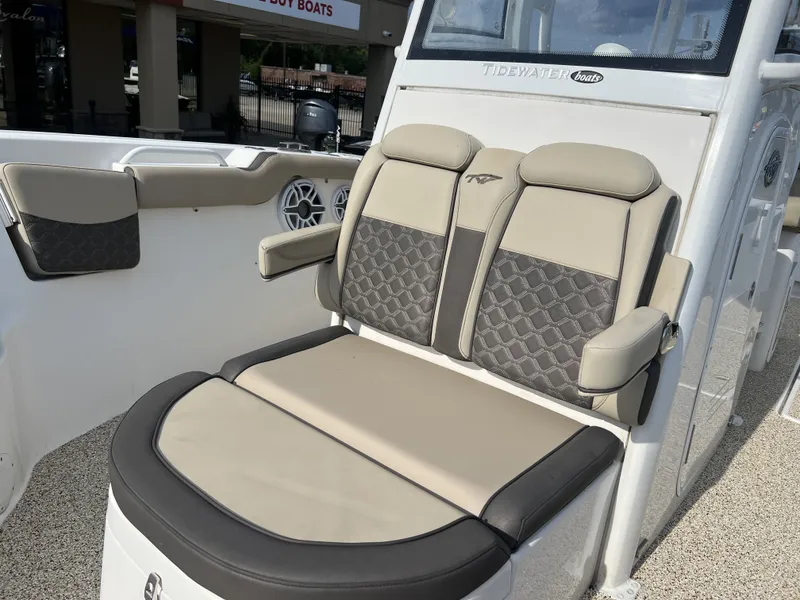 Slide: The Image of Tidewater 292 CC Adventure 2021 boat seat with cushioned design. - 25
