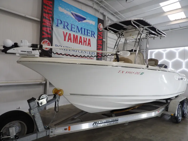 Slide: The Image of 2016 Key West 219 FS boat on trailer in showroom. - 13