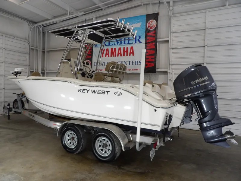 Slide: The Image of 2016 Key West 219 FS boat with Yamaha engine in warehouse. - 15
