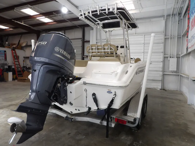 Slide: The Image of 2016 Key West 219 FS boat with Yamaha engine in warehouse. - 17