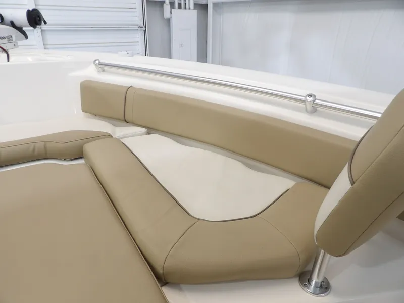 Slide: The Image of Interior view of a 2016 Key West 219 FS boat with beige upholstery. - 20