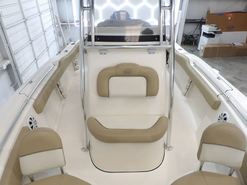 Slide: The Image of Interior view of a 2016 Key West 219 FS boat with beige seating. - 23