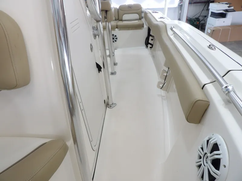 Slide: The Image of Interior of a 2016 Key West 219 FS boat with beige seating. - 26