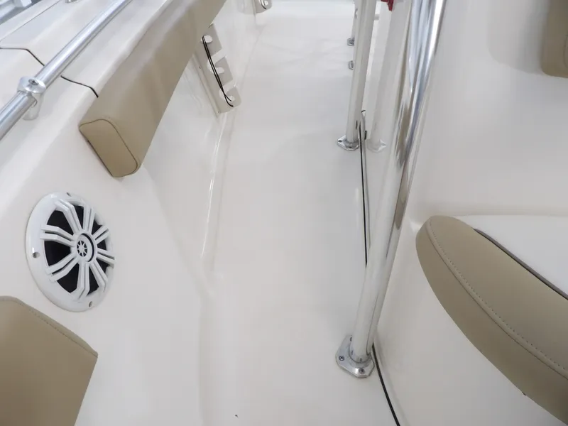 Slide: The Image of Interior of a 2016 Key West 219 FS boat with speaker and cushions. - 27