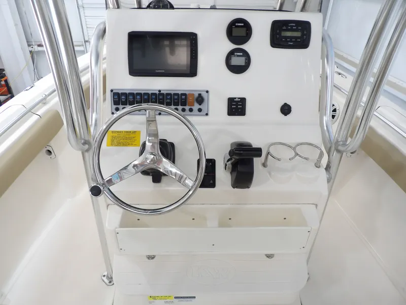 Slide: The Image of 2016 Key West 219 FS boat console with steering wheel and instruments. - 30