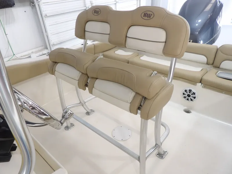 Slide: The Image of Interior of a 2016 Key West 219 FS boat with beige seating. - 31