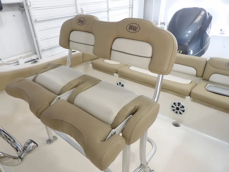 Slide: The Image of Interior view of a 2016 Key West 219 FS boat with beige seating. - 32